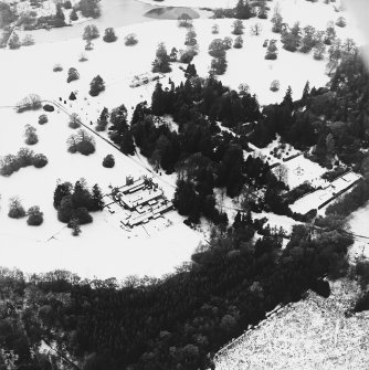Abercairny House, oblique aerial view, taken from the ENE, centred on the stable block and East walled garden.
