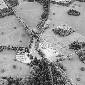 Oblique aerial view of Blair Castle centred on the country house and garden, taken from the NNW.