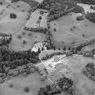 Oblique aerial view of Blair Castle centred on the country house, garden and walled garden, taken from the WSW.