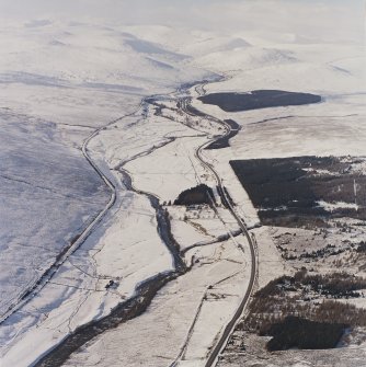 General oblique aerial view of the A9 road looking along Glen Garry towards the Grampian Mountains, taken from the ESE.