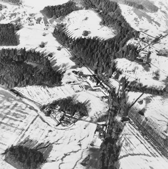 Oblique aerial view centred on the country house and garden, with the dairy and estate offices adjacent, taken from the SSE.