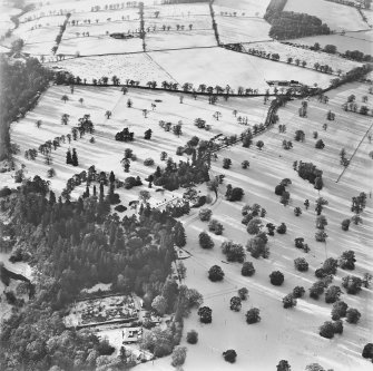 Culdees Castle and Policies, oblique aerial view, taken from the ENE, with the walled garden and stable block in the foreground.