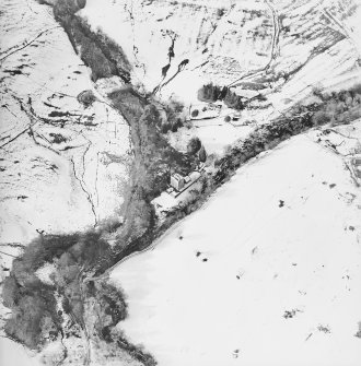 Oblique aerial view centred on the castle and tower-house, taken from the ESE.