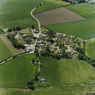 Oblique aerial view centred on the village of Fowlis Wester, taken from the NNW.