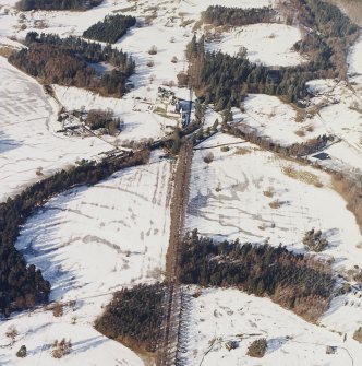 General oblique aerial view centred on the country house and garden, with the dairy adjacent, taken from the .