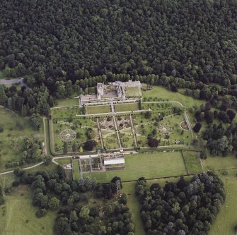Oblique aerial view centred on Drummond Castle and gardens, taken from the S