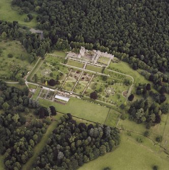 Oblique aerial view centred on Drummond Castle and gardens, taken from the SSE