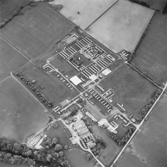 Oblique aerial view centred on the military camp with the bunker, observation post and remains of the church and graveyard adjacent, taken from the S.
