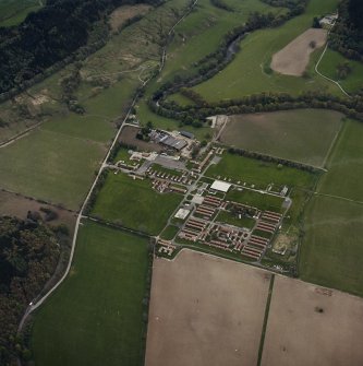 Oblique aerial view centred on the military camp with the bunker, observation post and remains of the church and graveyard adjacent, taken from the NE.