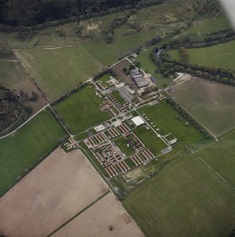 Oblique aerial view centred on the military camp with the bunker, observation post and remains of the church and graveyard adjacent, taken from the N.