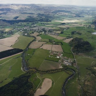 Oblique aerial view looking across the military camp and house towards Comrie, taken from the SW.