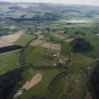 General oblique aerial view looking across the military camp and house towards Comrie, taken from the SW.