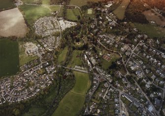 Oblique aerial view of Crieff centred on the bridge and manse, taken from the S.