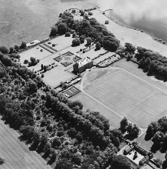 Oblique aerial view of Kinross House country house with garden, gate, stables and church and burial ground visible, taken from the NNW.