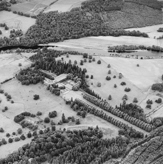 Oblique aerial view of Murthly Castle centred on the castle and walled garden, taken from the SW.