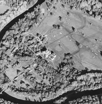 Oblique aerial view centred on the country house with golf club house and remains of military camp adjacent, taken from the W.