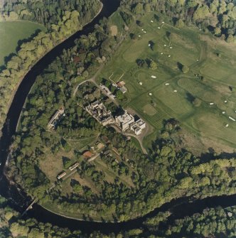 Oblique aerial view centred on the country house with golf club house and remains of military camp adjacent, taken from the W.