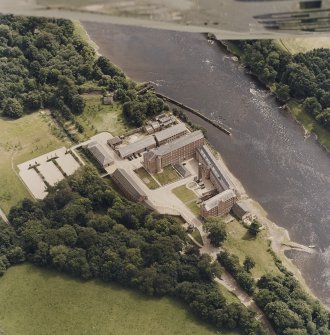 Oblique aerial view centred on the mill, taken from the NW.