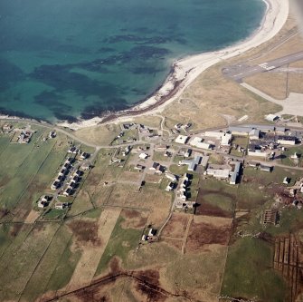 Oblique aerial view centred on the village, taken from the SSE.