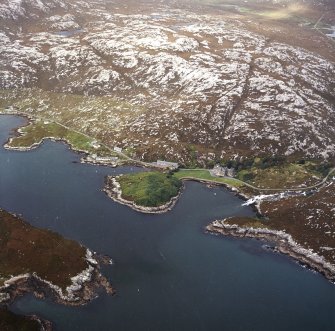 Oblique aerial view centred on the country house with the pier adjacent, taken from the SW.