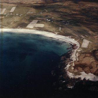 General oblique aerial view looking towards the bay of Culla across the farmhouse, the farmstead, the farmsteading and the burial enclosures adjacent, taken from the WSW