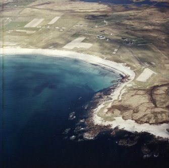General oblique aerial view looking towards the bay of Culla across the farmhouse, the farmstead, the farmsteading and the burial enclosures adjacent, taken from the WSW