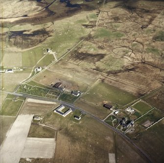 Oblique aerial view centred on the farmsteads and the farmsteadings, with the farmhouse and the burial enclosures adjacent, taken from the WNW
