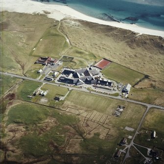 Oblique aerial view centred on the school, the museum and the hotel, taken from the N.