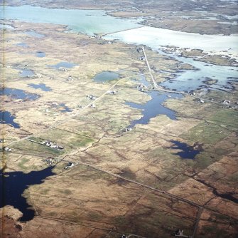 General oblique aerial view centred over the crofting township of Liniclate and Creag Ghoraidh looking towards South Uist beyond, taken from the NNW.