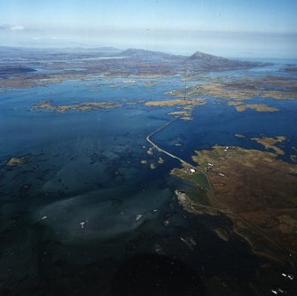 General oblique aerial view centred on the causeway, looking across Grimsey towards Eavel in the distance, taken from the SW.
