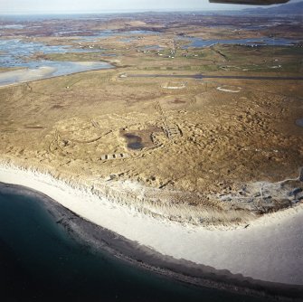 General oblique aerial view looking over Benbecula airport and Gramasdail towards The Little Minch beyond, taken from the NNW.