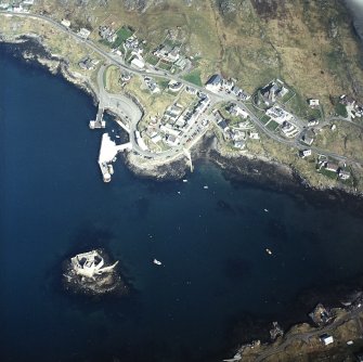 Oblique aerial view centred on the town with the tower-house, church and pier adjacent, taken from the SSE.

