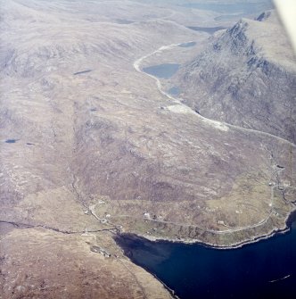 General oblique aerial view centred on the township with the quarry adjacent, taken from the WSW.
