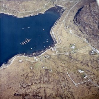 Oblique aerial view centred on the township and the remains of the buildings, taken from the SW.
