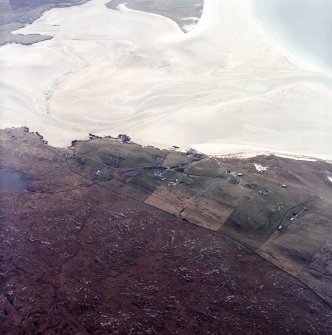 Oblique aerial view centred on the township, burial ground and remains of the buildings, taken from the NNE.
