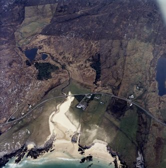 Oblique aerial view centred on the lodge and house, taken from the NW.