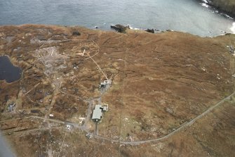 Oblique aerial view centred on the remains of the radar station, taken from the WNW.