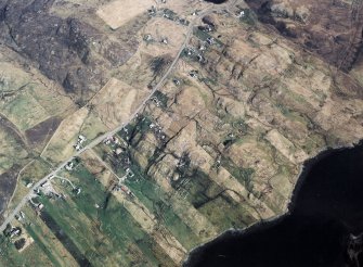 Oblique aerial view centred over the township and the remains of the buildings, taken from the SW.