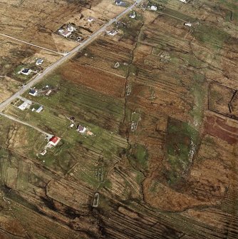 Oblique aerial view centred on the township and the remains of the buildings, taken from the WSW.