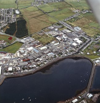 Oblique aerial view centred on Newton Street and the industrial estate, taken from the WSW.