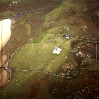 Oblique aerial view centred on the shooting lodge and lazy beds with the cottage and kennels adjacent, taken from the SSE.