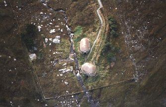 Oblique aerial view centred on the reconstructed horizontal mill and corn drying kiln, taken from the N.