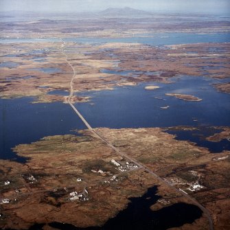 General oblique aerial view looking over West Gerinish towards Eochar and Benbecula beyond, taken from the SW.