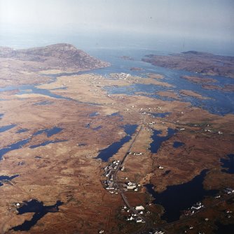 General oblique aerial view looking over the remains of the township, towards Lochboisdale and The Minch beyond, taken from the WNW.