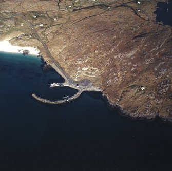 Oblique aerial view centred on the slipway and the jetty  with the remains of the township adjacent, taken from the W.