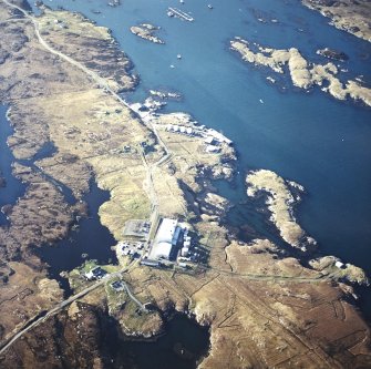 Oblique aerial view centred on the power station, with the jetty and township adjacent, taken from the SSE.