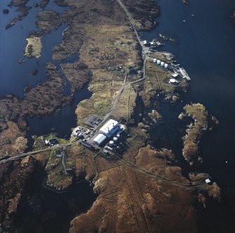 Oblique aerial view centred on the power station, with the jetty and township adjacent, taken from the ESE.