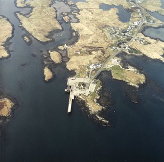 Oblique aerial view centred on the pier and ferry terminal, taken from the SE.