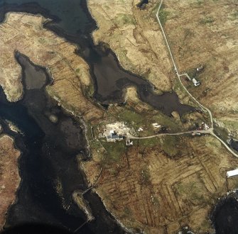 Oblique aerial view centred on the house and the site of the works, taken from the SE.