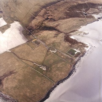 Oblique aerial view centred on the country house and the remains of the house, farmstead and walled garden, taken from the SSW.